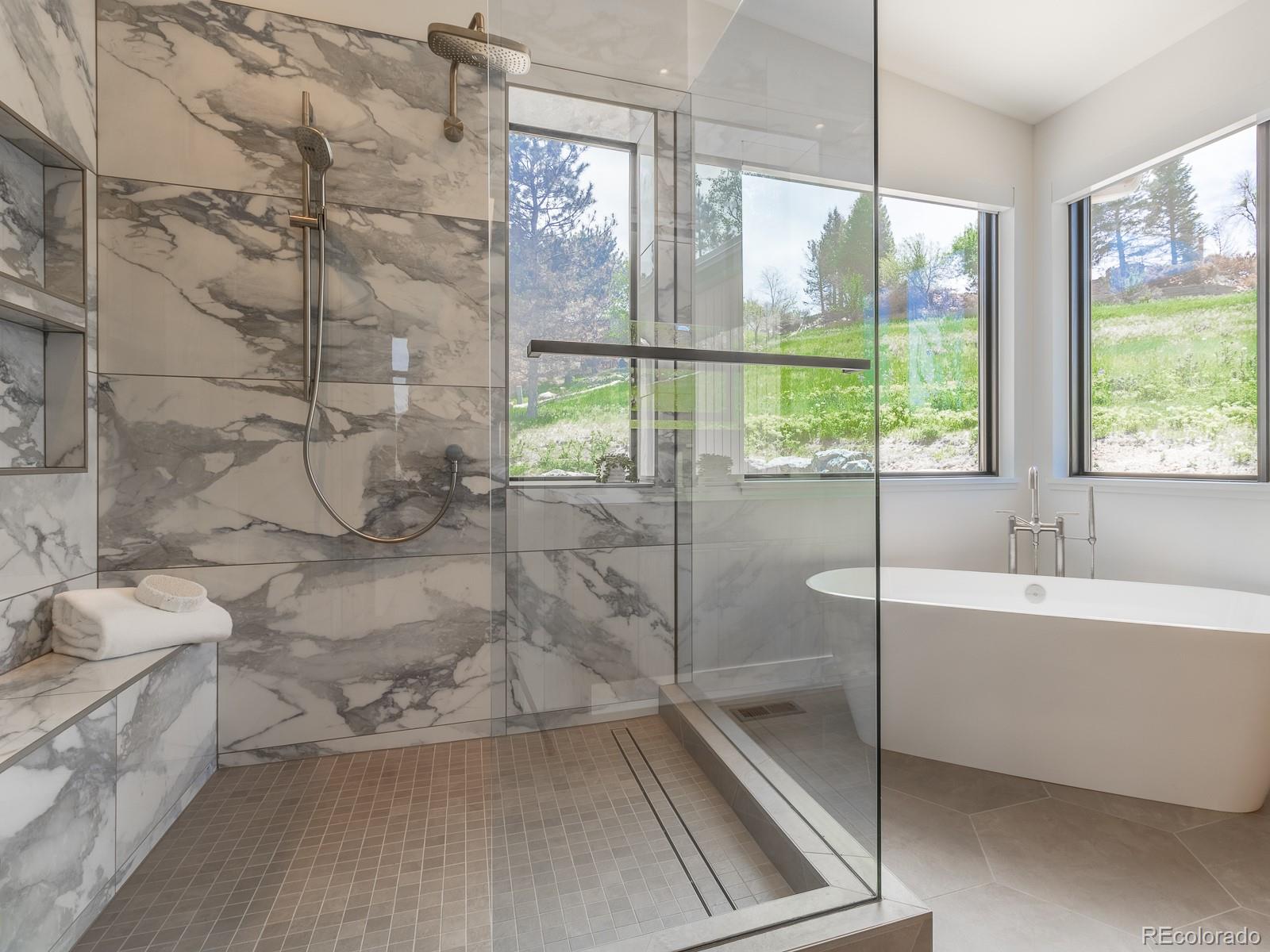 7526 Spring Drive Boulder, CO 80303 - Photo 25 of 40 a bathroom with a tub sink and window