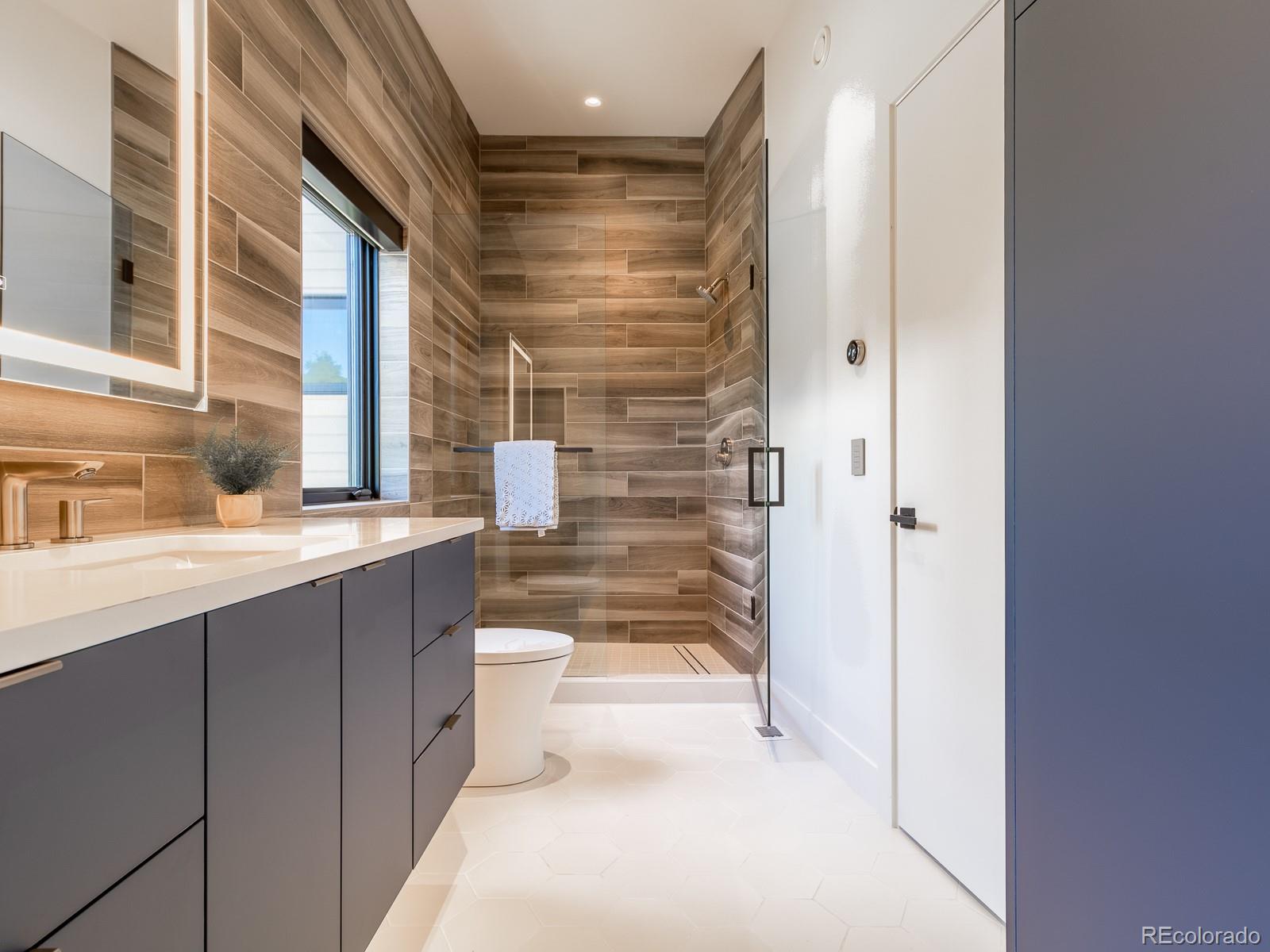 7526 Spring Drive Boulder, CO 80303 - Photo 36 of 40 a bathroom with a sink a toilet and shower