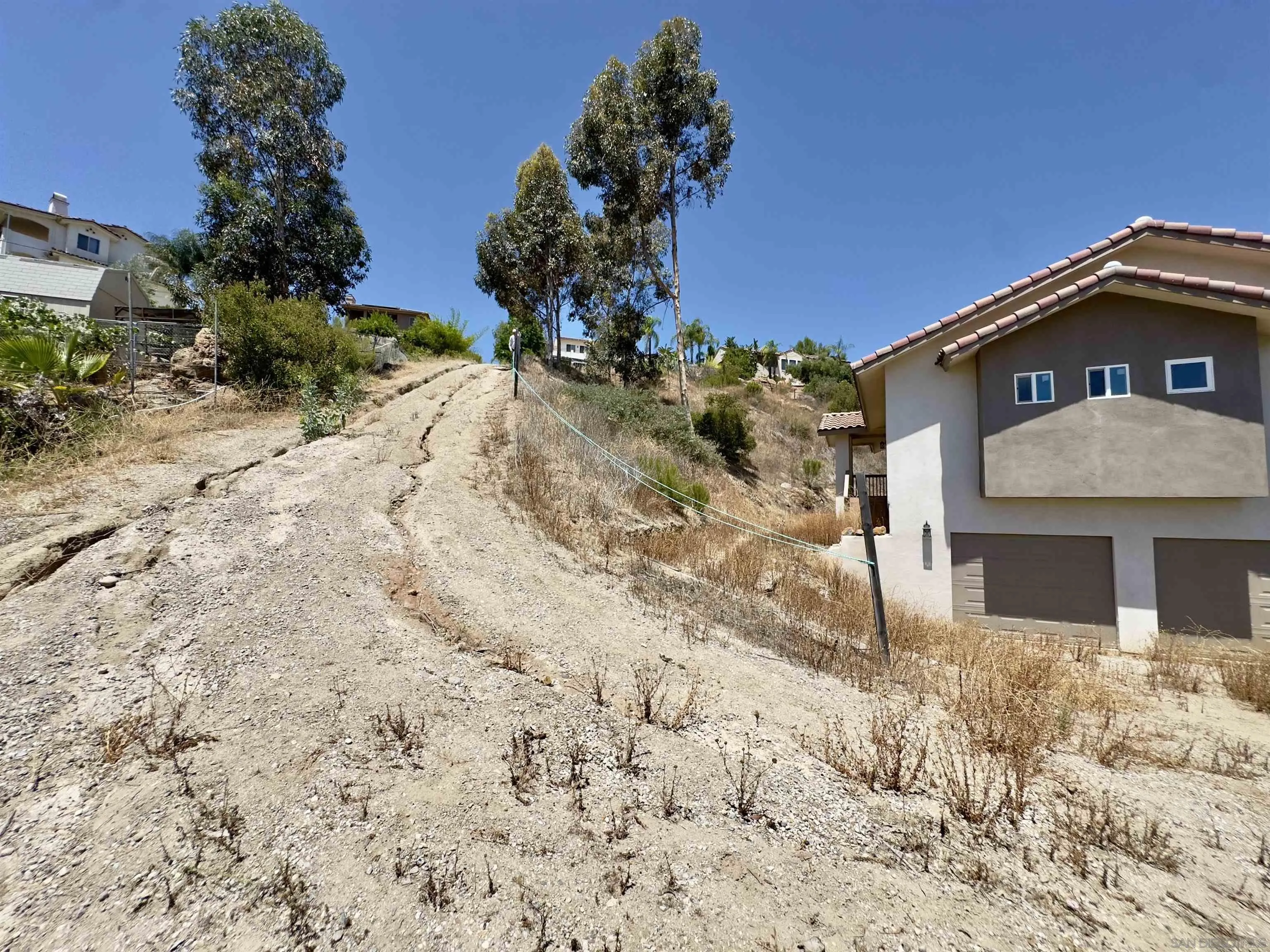 11677 Valle Vista Road Lakeside, CA 92040 - Photo 11 of 44 a front view of a house with a yard