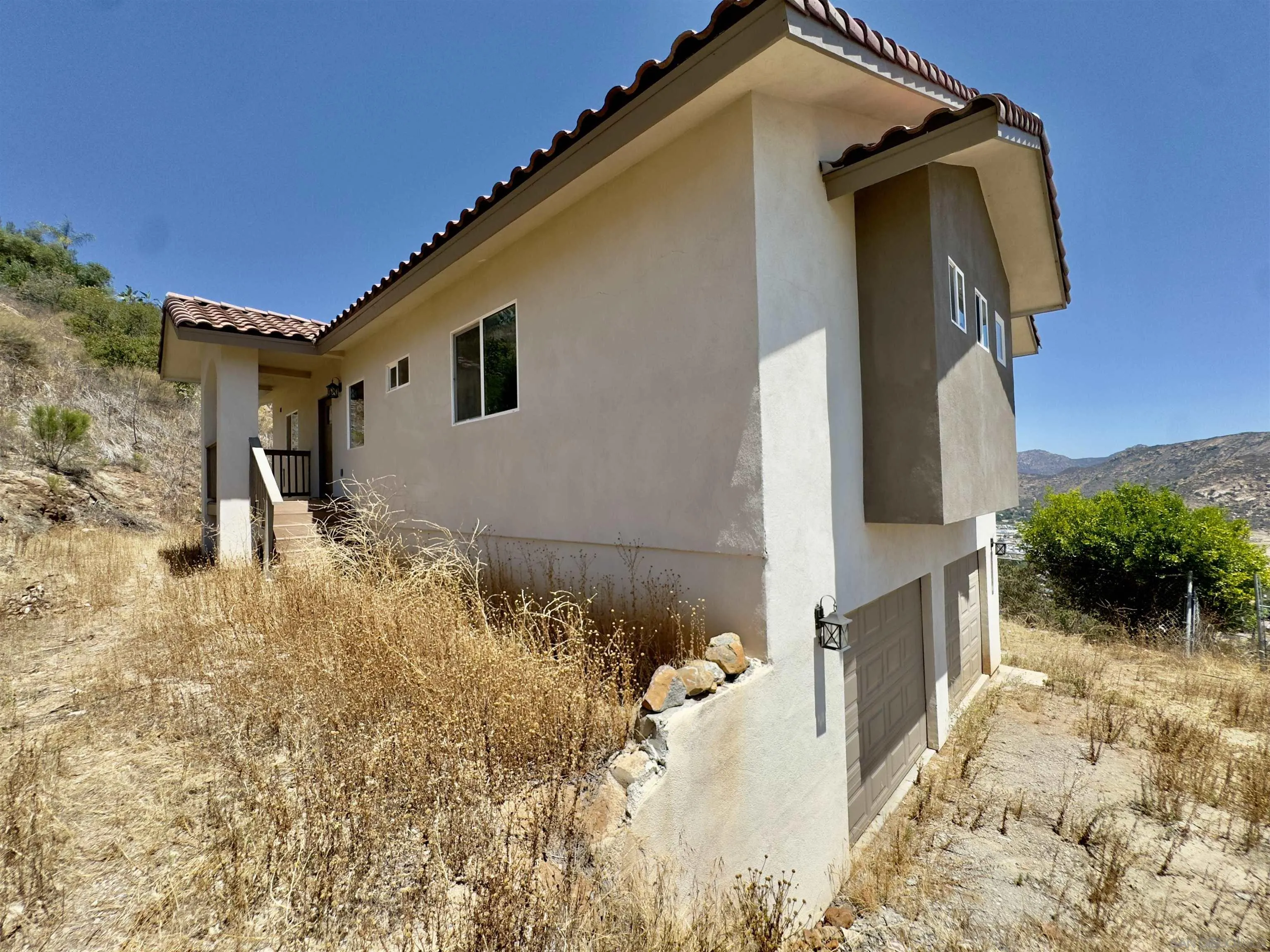 11677 Valle Vista Road Lakeside, CA 92040 - Photo 12 of 44 a front view of a house with a yard