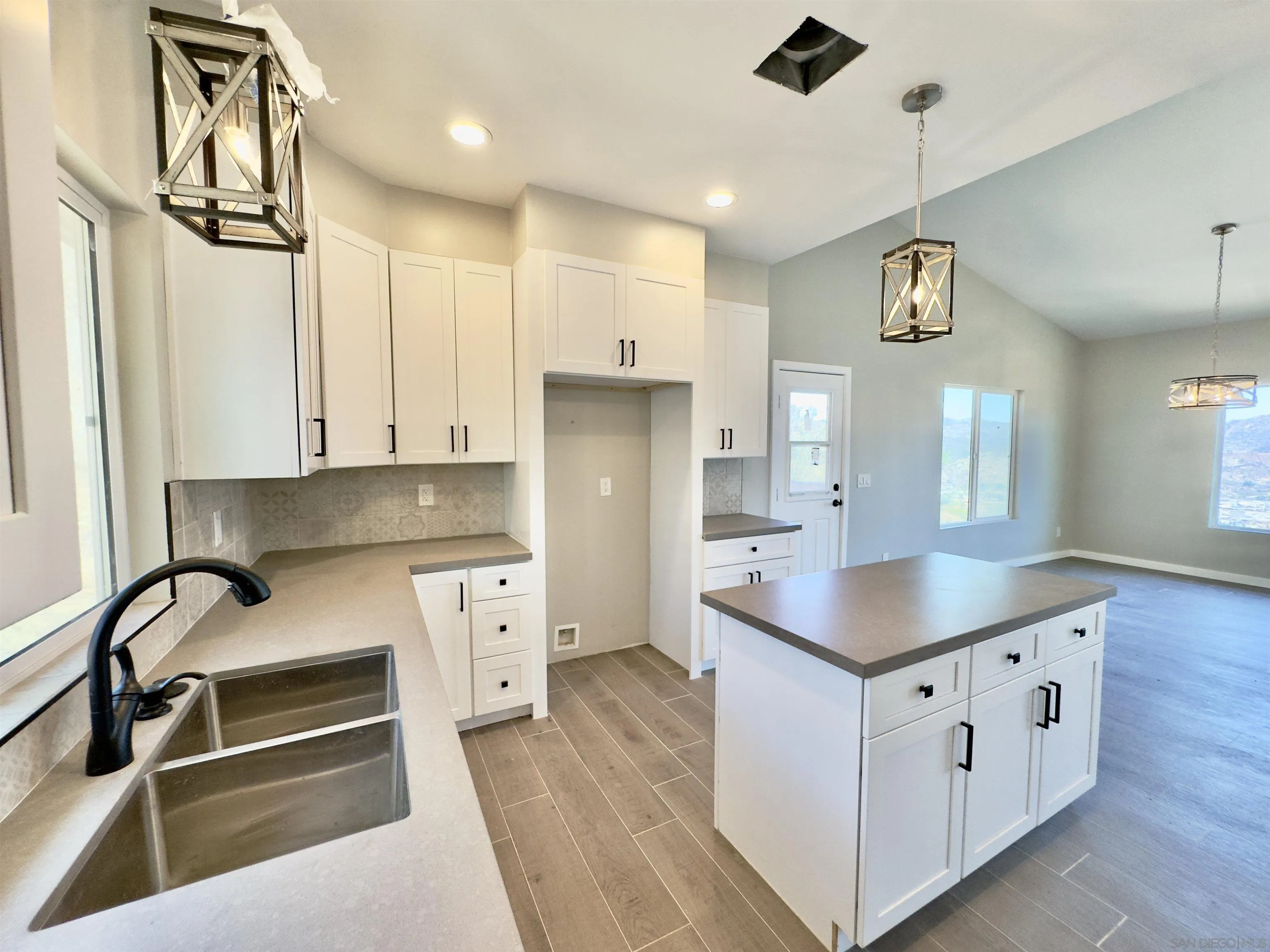 11677 Valle Vista Road Lakeside, CA 92040 - Photo 15 of 44 a kitchen with white cabinets and sink