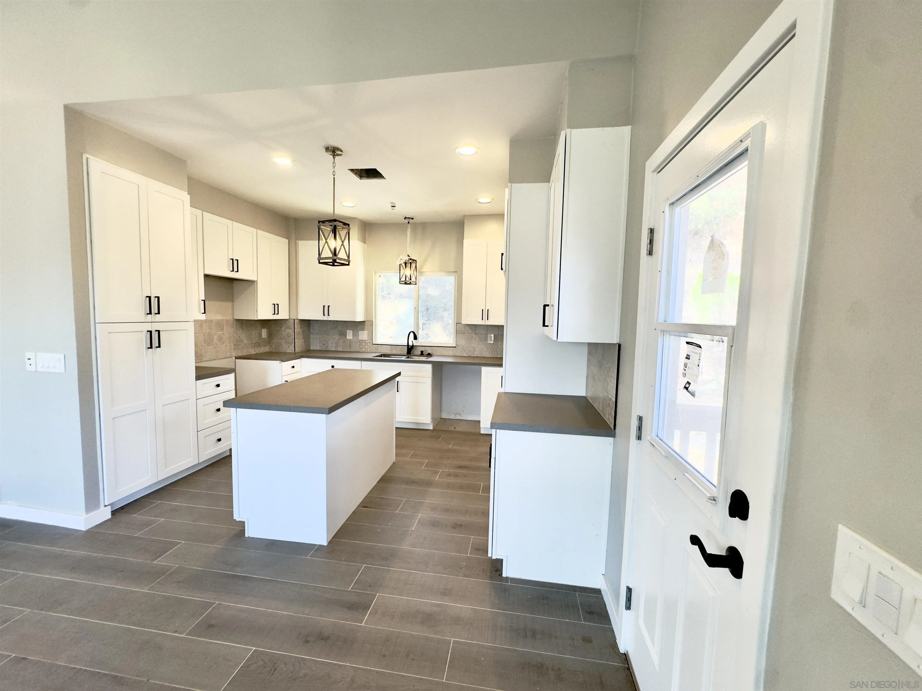 11677 Valle Vista Road Lakeside, CA 92040 - Photo 16 of 44 a large kitchen with a large counter top appliances and cabinets