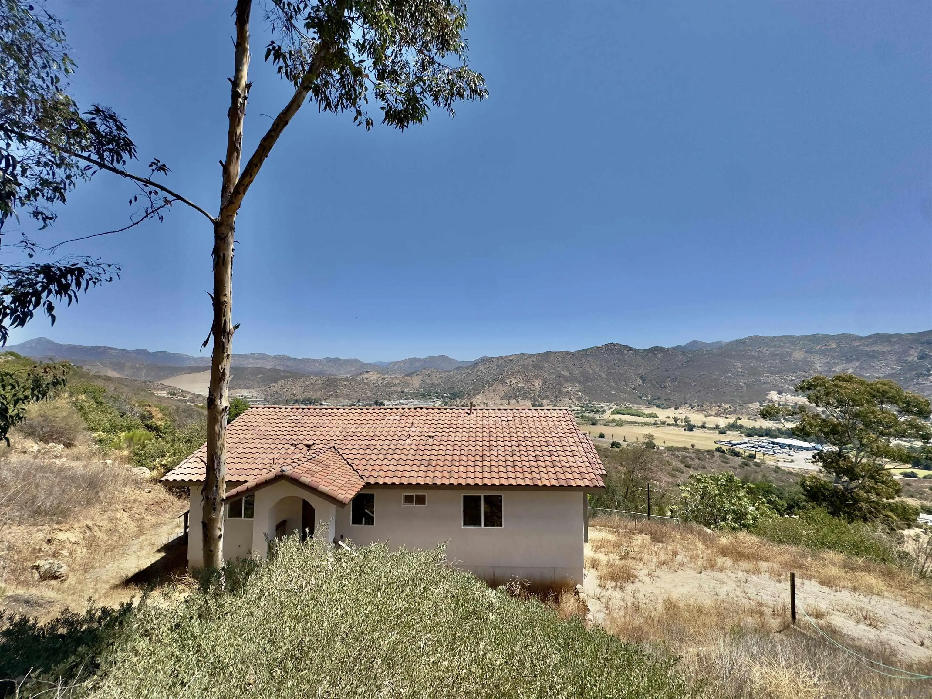 11677 Valle Vista Road Lakeside, CA 92040 - Photo 2 of 44 an aerial view of a house with a mountain