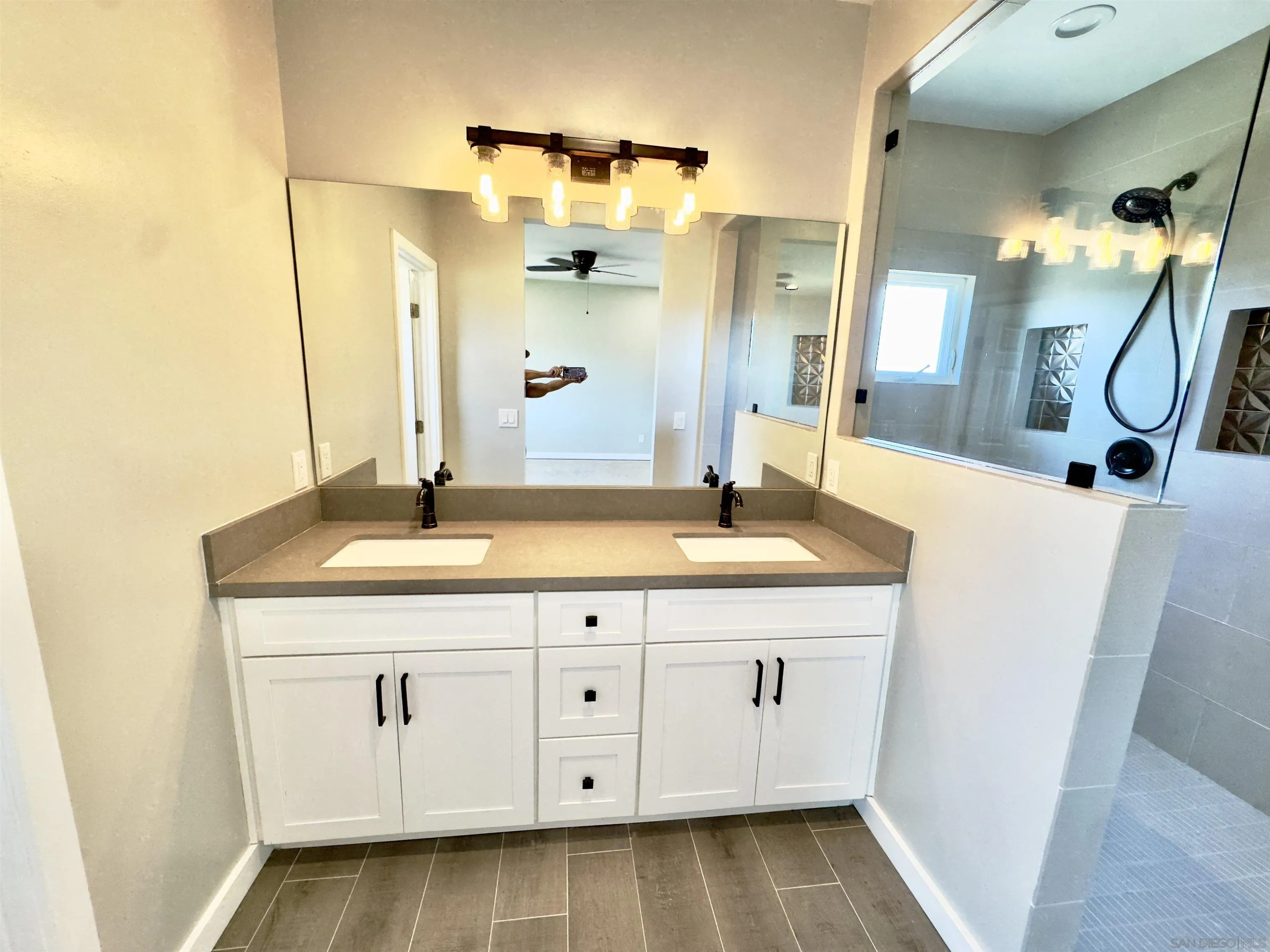 11677 Valle Vista Road Lakeside, CA 92040 - Photo 22 of 44 a bathroom with a sink and a mirror