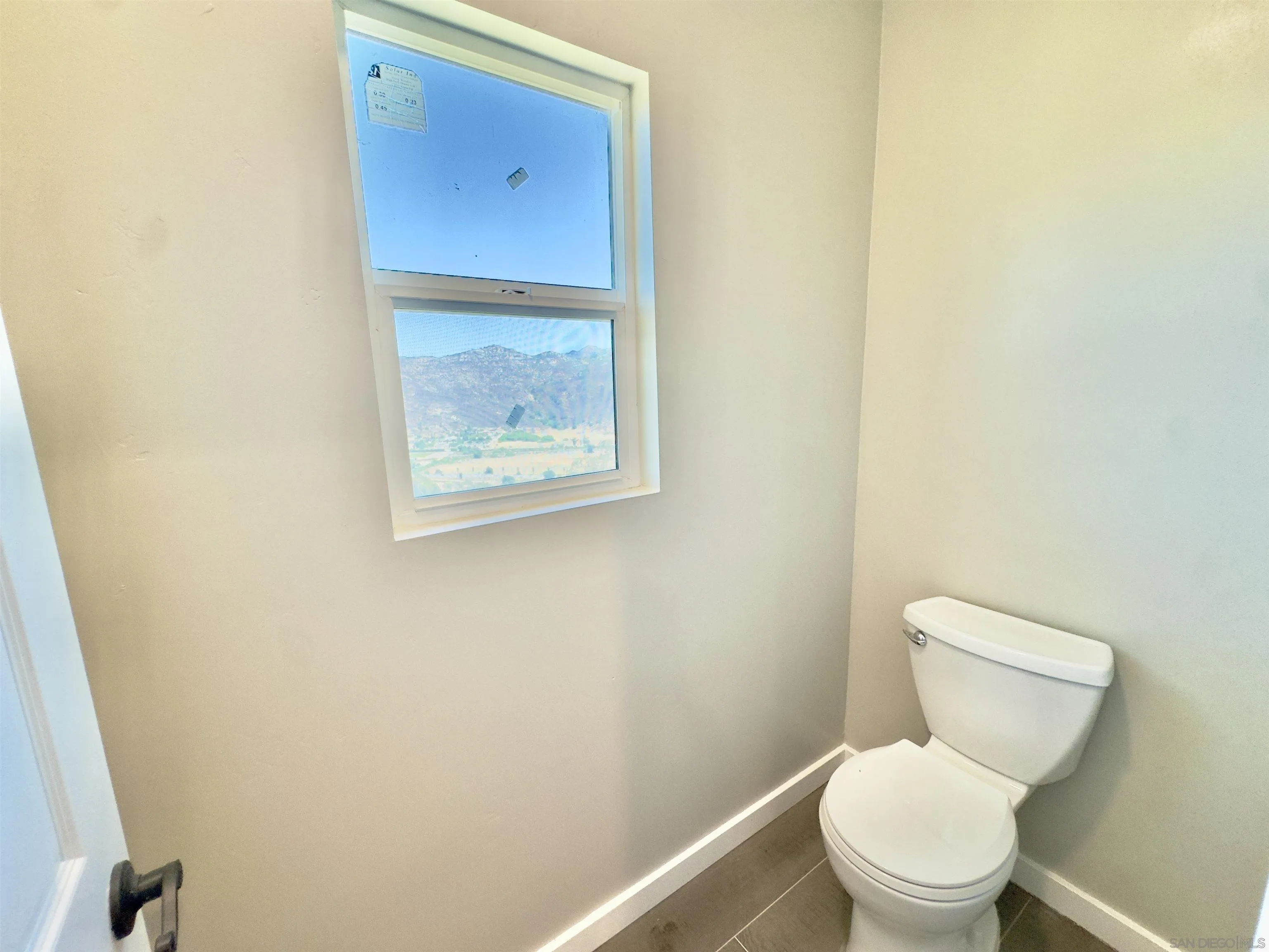 11677 Valle Vista Road Lakeside, CA 92040 - Photo 25 of 44 a white toilet sitting next to a white wall