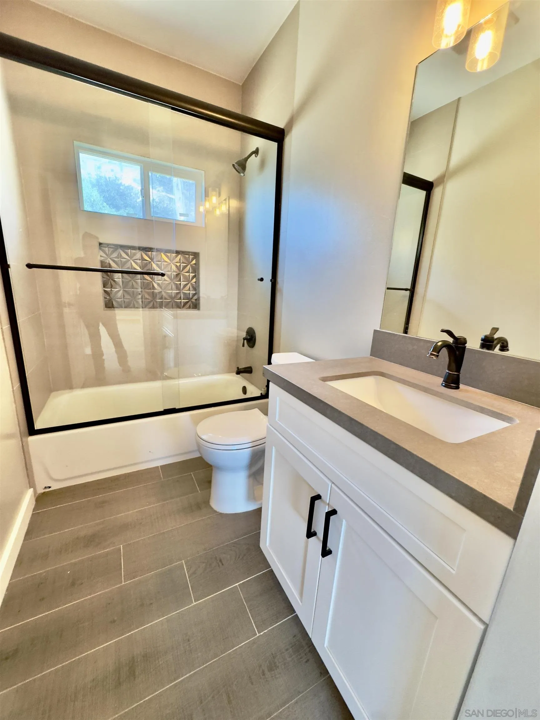 11677 Valle Vista Road Lakeside, CA 92040 - Photo 26 of 44 a bathroom with a sink and a mirror