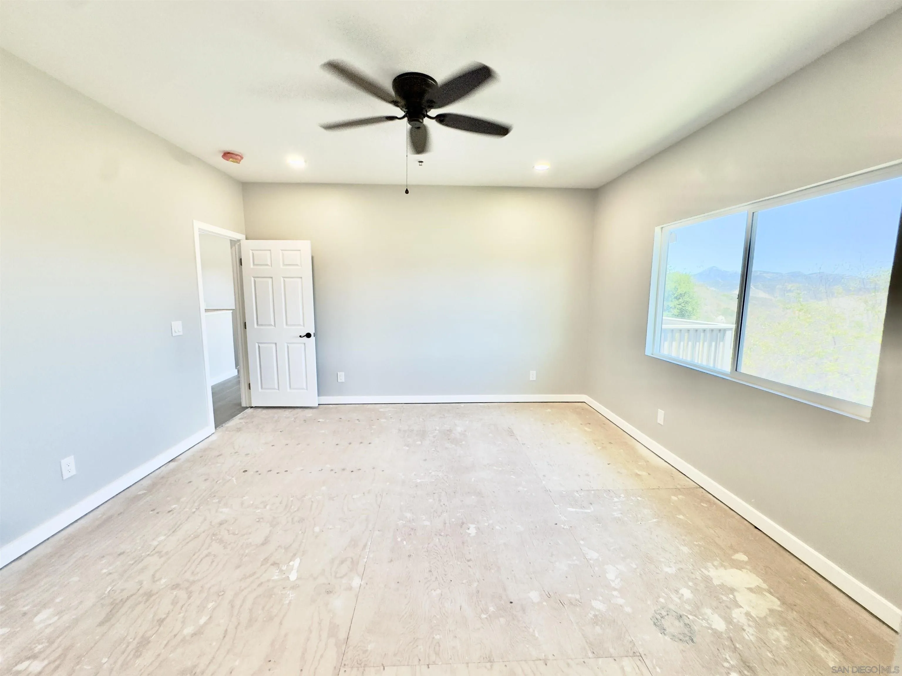 11677 Valle Vista Road Lakeside, CA 92040 - Photo 27 of 44 a view of an empty room with a window