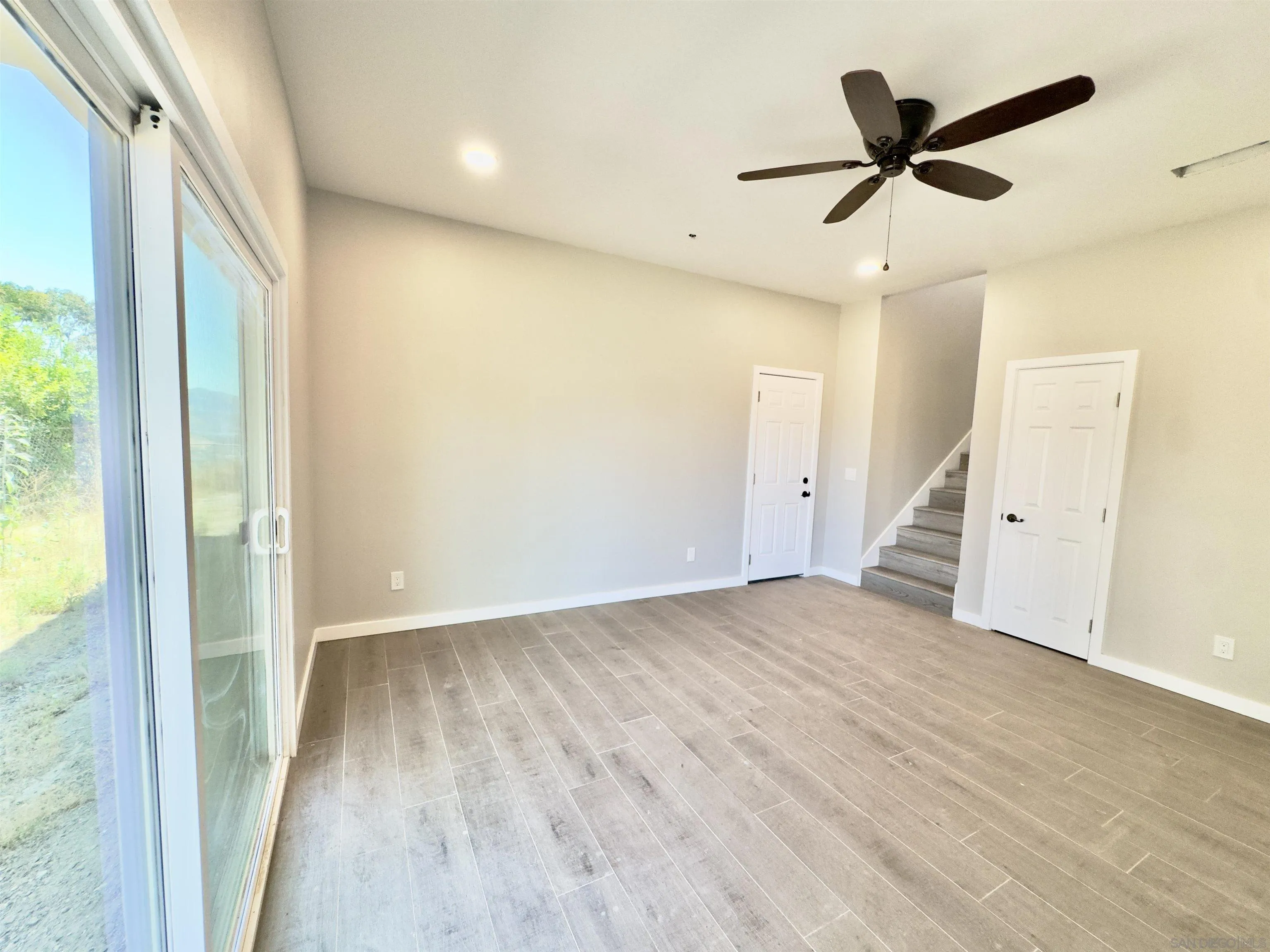 11677 Valle Vista Road Lakeside, CA 92040 - Photo 29 of 44 wooden floor in an empty room with a window