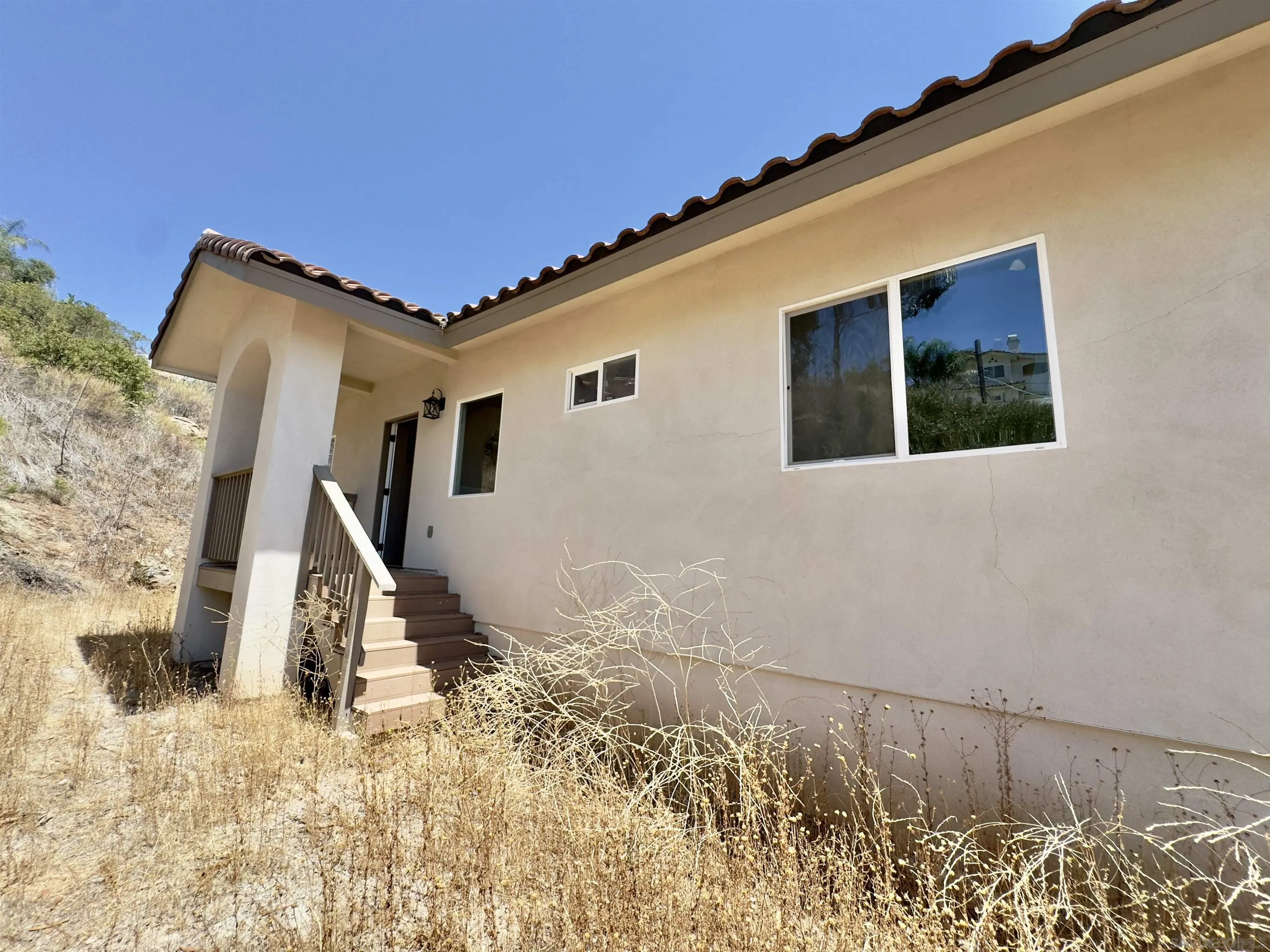 11677 Valle Vista Road Lakeside, CA 92040 - Photo 4 of 44 a view of a house with a snow in the background