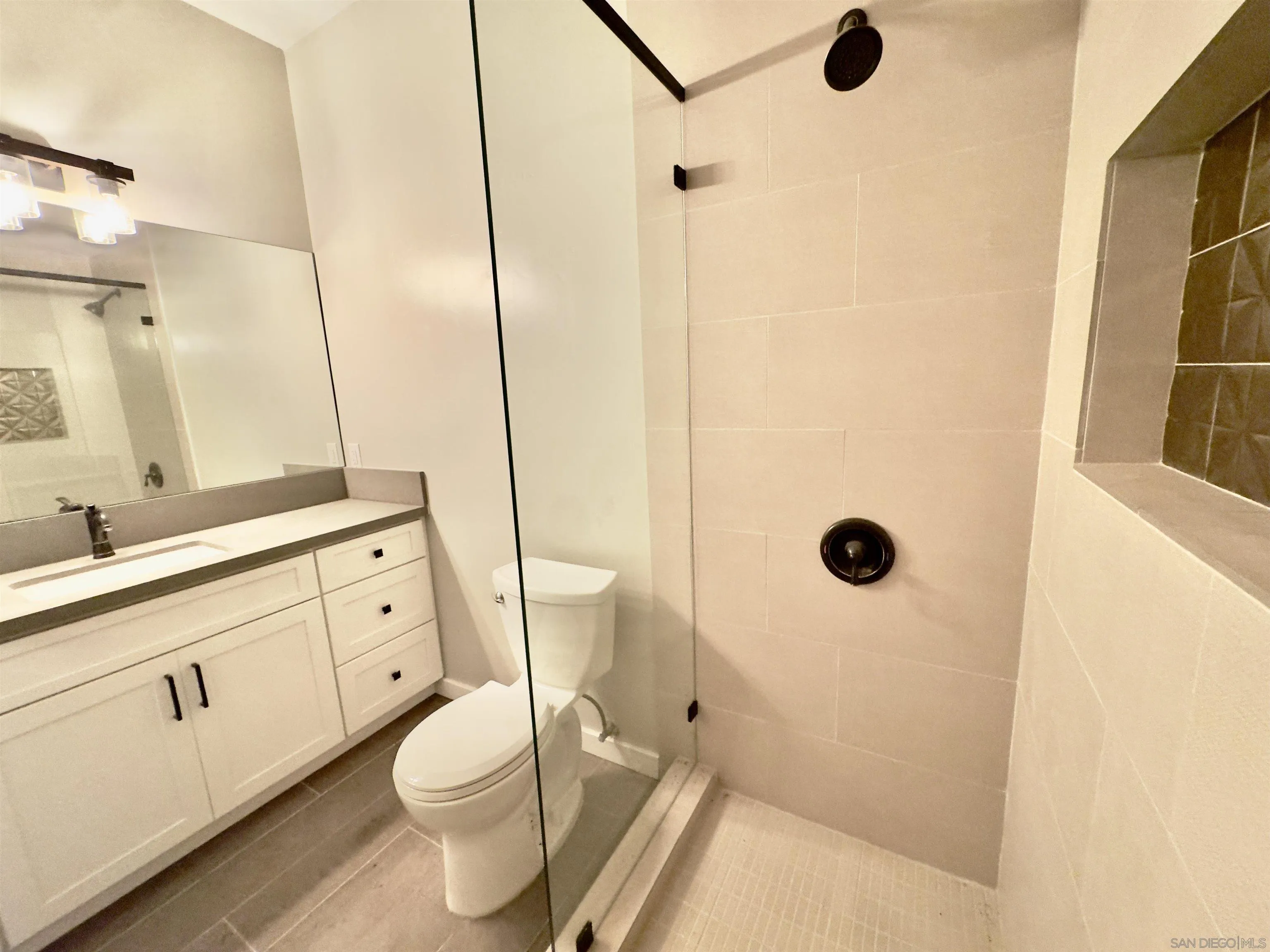 11677 Valle Vista Road Lakeside, CA 92040 - Photo 41 of 44 a bathroom with a sink a toilet and shower