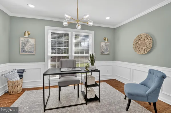 a bedroom with a bed a window and dresser