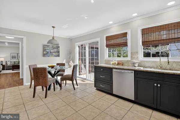 a kitchen with stainless steel appliances granite countertop a stove and a sink