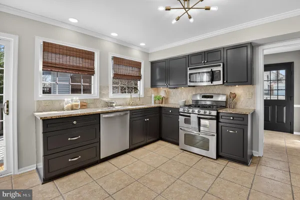 a view of a backyard with sitting area