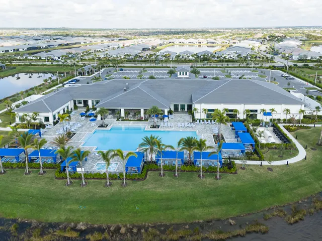 an aerial view of house with yard swimming pool and outdoor seating