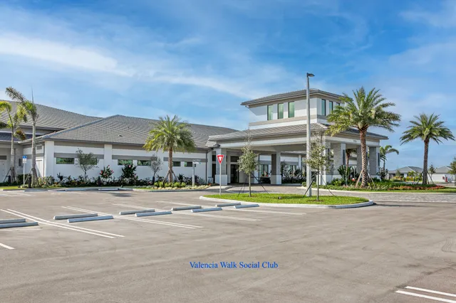 a large building with trees in the background