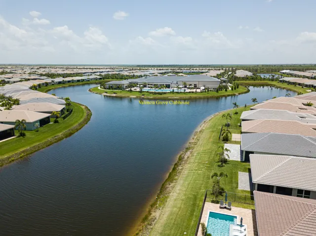 an aerial view of a house with a swimming pool