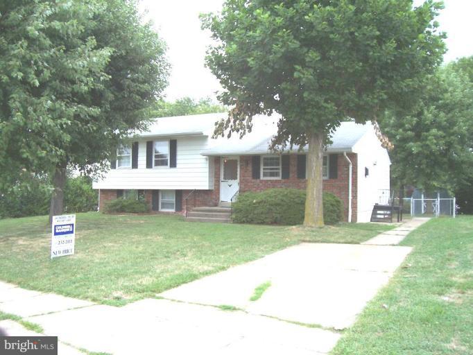 9105 Kilbride Road Nottingham, MD 21236 - Photo 1 of 13 a front view of a house with a yard