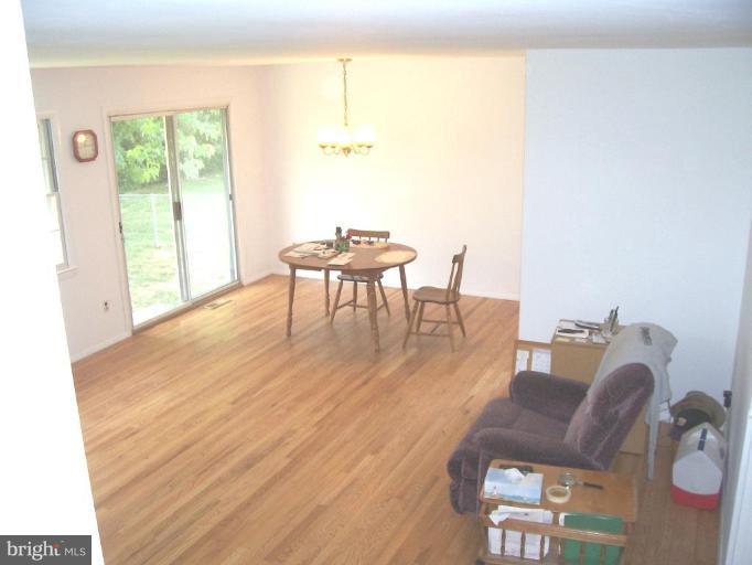 9105 Kilbride Road Nottingham, MD 21236 - Photo 3 of 13 a dining room with furniture and wooden floor