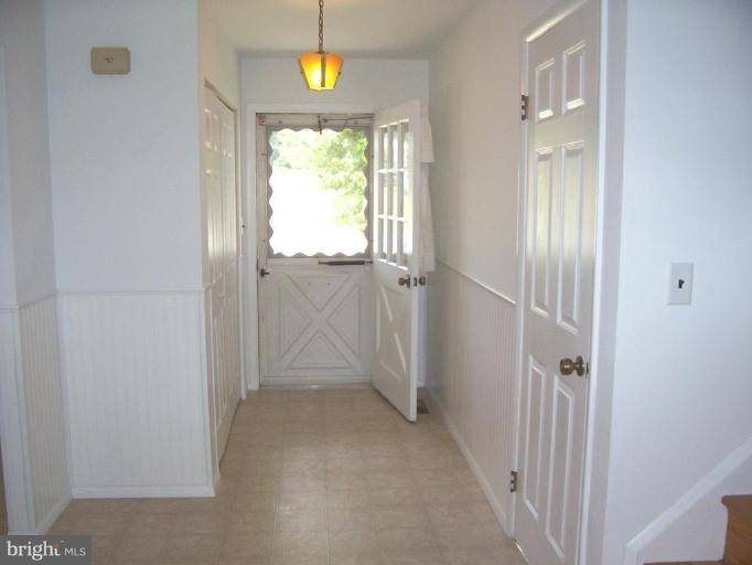 9105 Kilbride Road Nottingham, MD 21236 - Photo 4 of 13 a view of an entryway with wooden floor