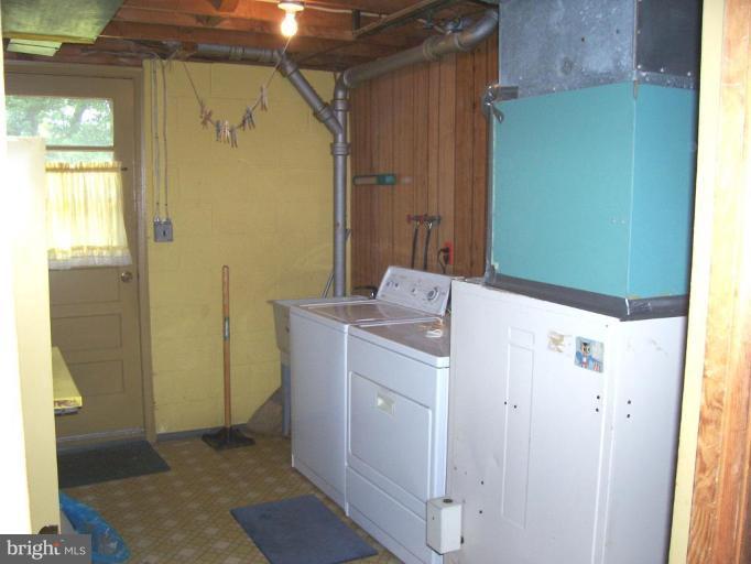 9105 Kilbride Road Nottingham, MD 21236 - Photo 6 of 13 a bathroom with a sink and a mirror