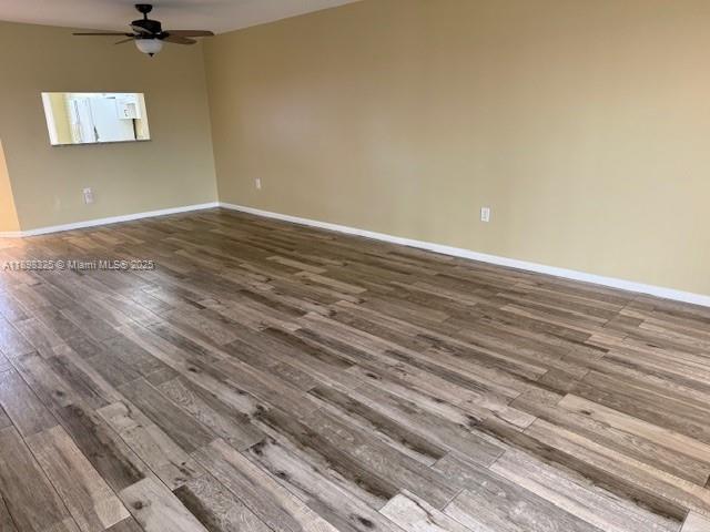 850 Southwest 138th Avenue, Unit 410D Pembroke Pines, FL 33027 - Photo 15 of 29 an empty room with a wooden floor and windows