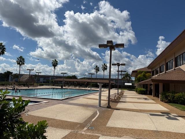 850 Southwest 138th Avenue, Unit 410D Pembroke Pines, FL 33027 - Photo 26 of 29 a view of a terrace with sitting area