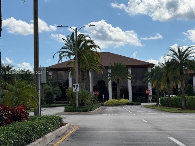 850 Southwest 138th Avenue, Unit 410D Pembroke Pines, FL 33027 - Photo 28 of 29 a view of a house and a yard in front of it