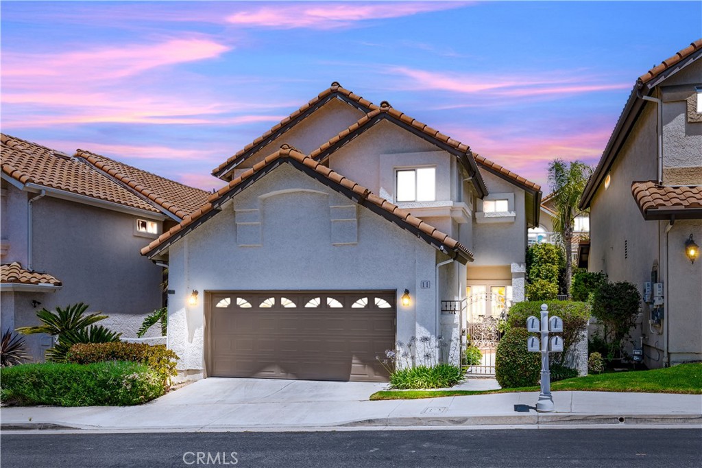 11 Finca San Clemente, CA 92672 - Photo 1 of 55 a front view of a house with a yard