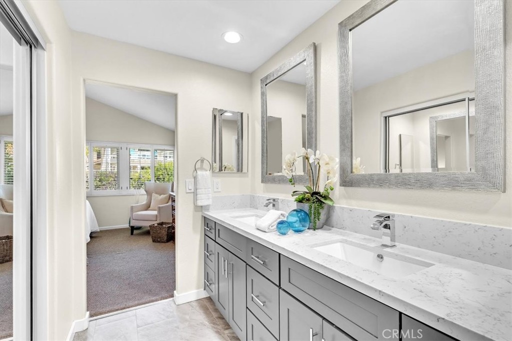 11 Finca San Clemente, CA 92672 - Photo 20 of 55 a spacious en suite bathroom with a double sink and mirror