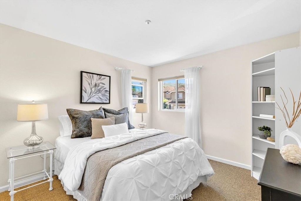 11 Finca San Clemente, CA 92672 - Photo 21 of 55 a bedroom with a bed and a painting on the wall