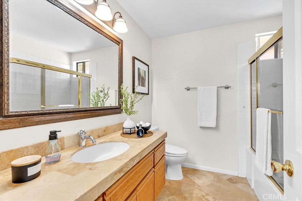 11 Finca San Clemente, CA 92672 - Photo 22 of 55 a bathroom with a granite countertop sink and a large mirror