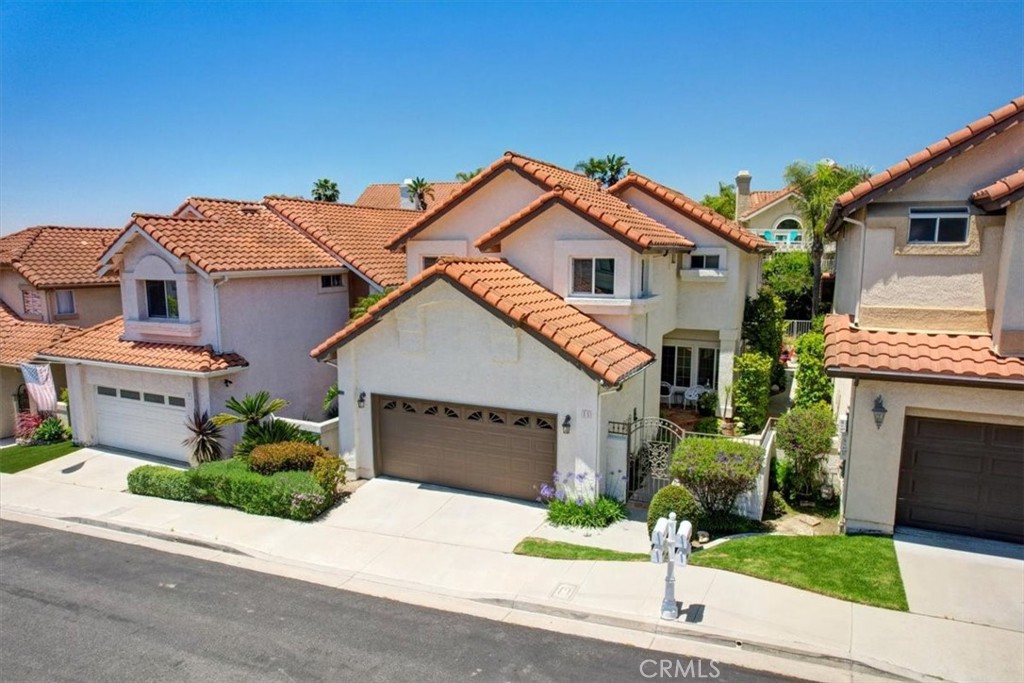 11 Finca San Clemente, CA 92672 - Photo 32 of 55 a front view of a house with a yard and garage