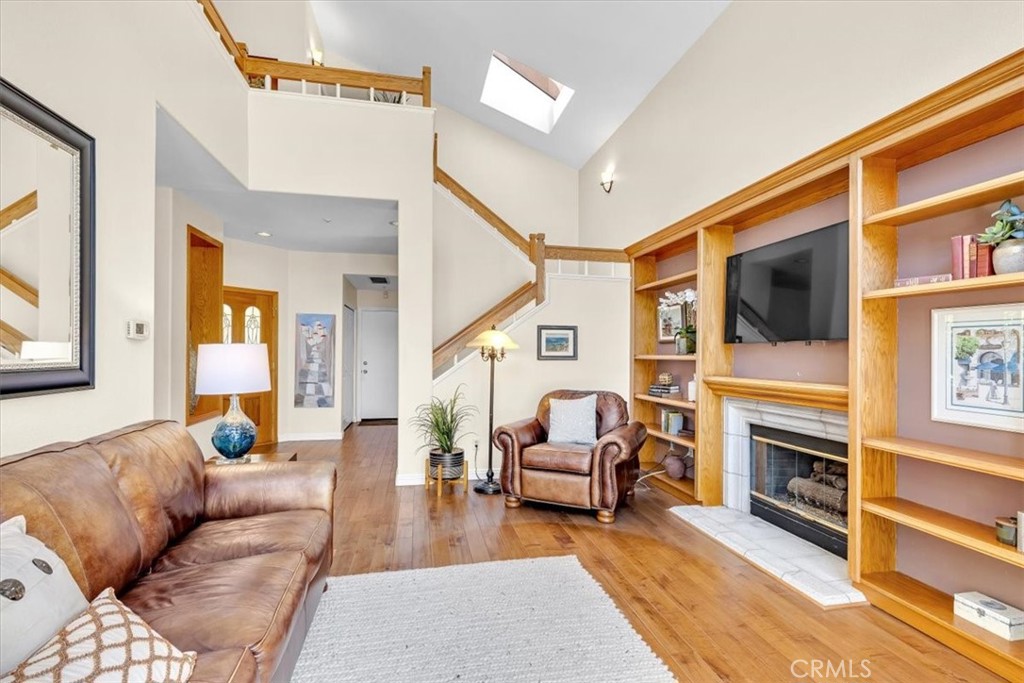 11 Finca San Clemente, CA 92672 - Photo 6 of 55 a living room with furniture a fireplace and a flat screen tv