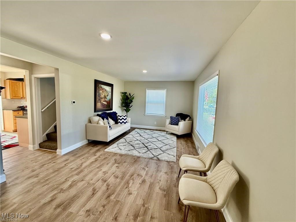 1644 Canton Road Akron, OH 44312 - Photo 7 of 25 Living room with light wood finished floors, stairway, baseboards, and recessed lighting