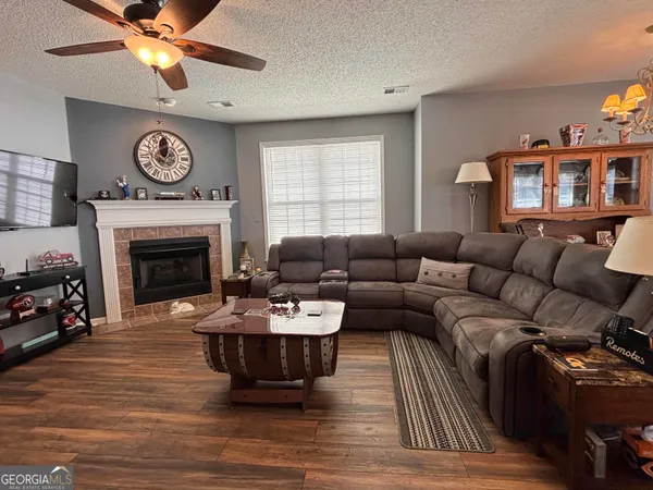 a kitchen with stainless steel appliances a sink stove and wooden cabinets
