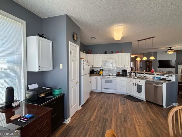 a bathroom with a sink vanity and a mirror