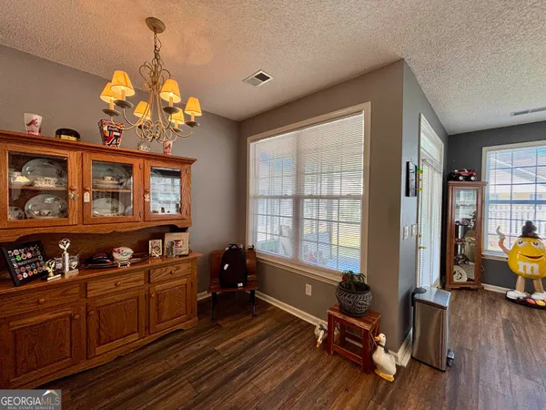 a bedroom with a bed and a television