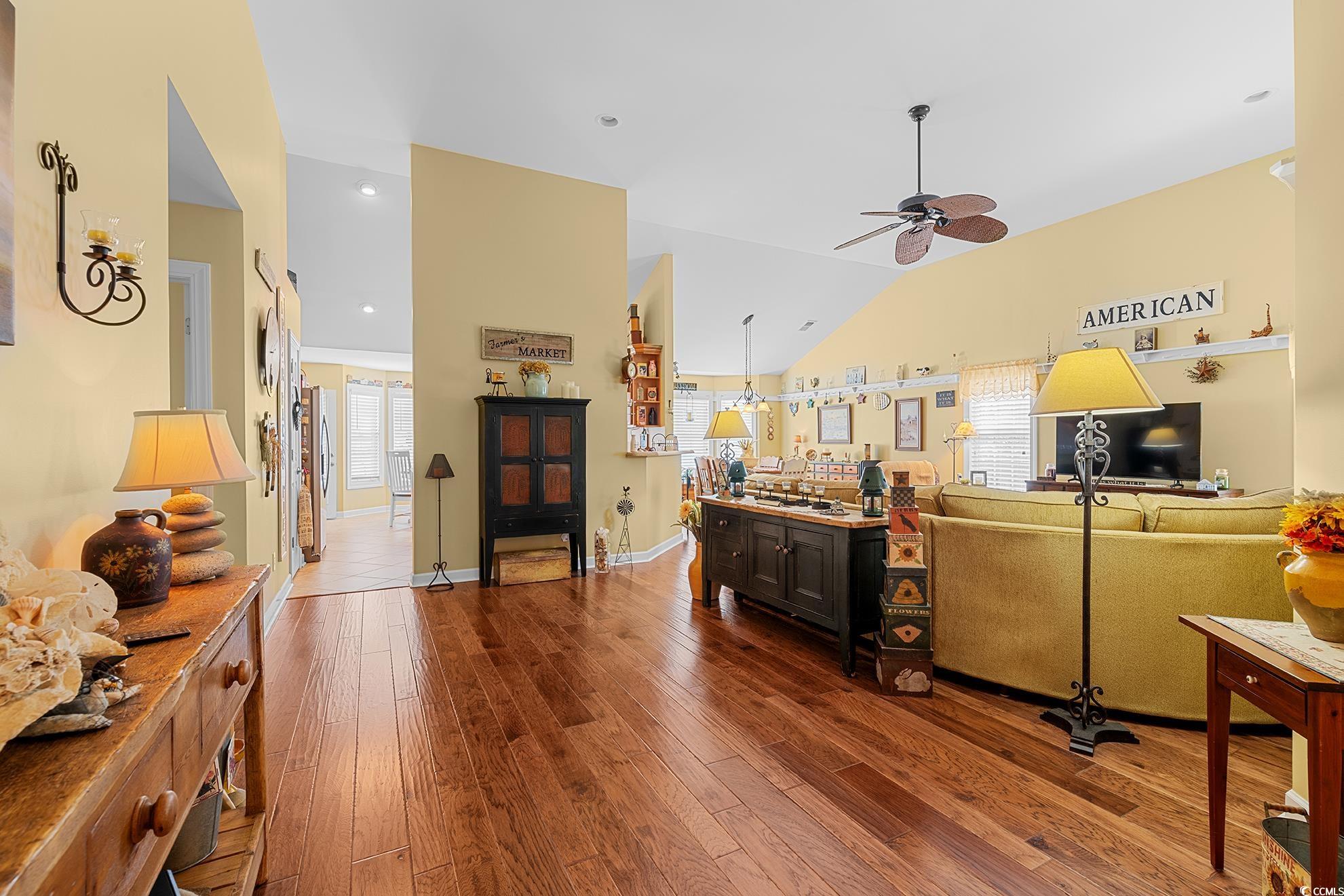 4100 Eva Bay Drive Murrells Inlet, SC 29576 - Photo 7 of 39 Living room featuring baseboards, lofted ceiling,
