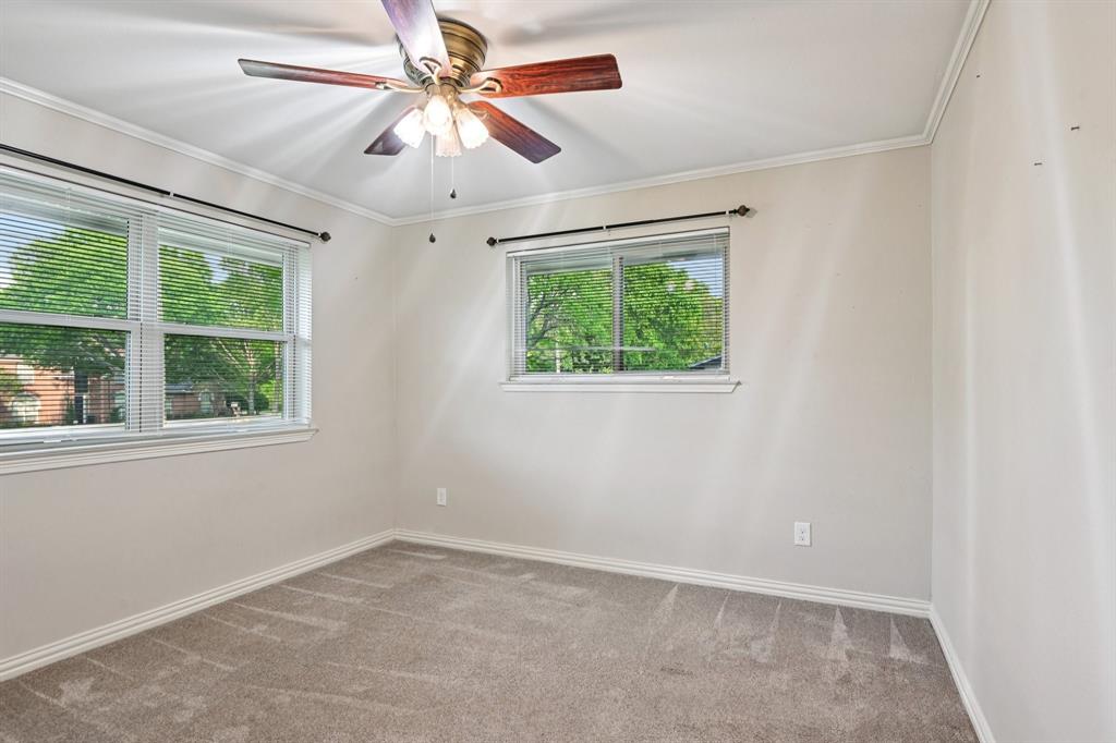 305 South Cockrell Hill Road Ovilla, TX 75154 - Photo 19 of 40 an empty room with windows and fan