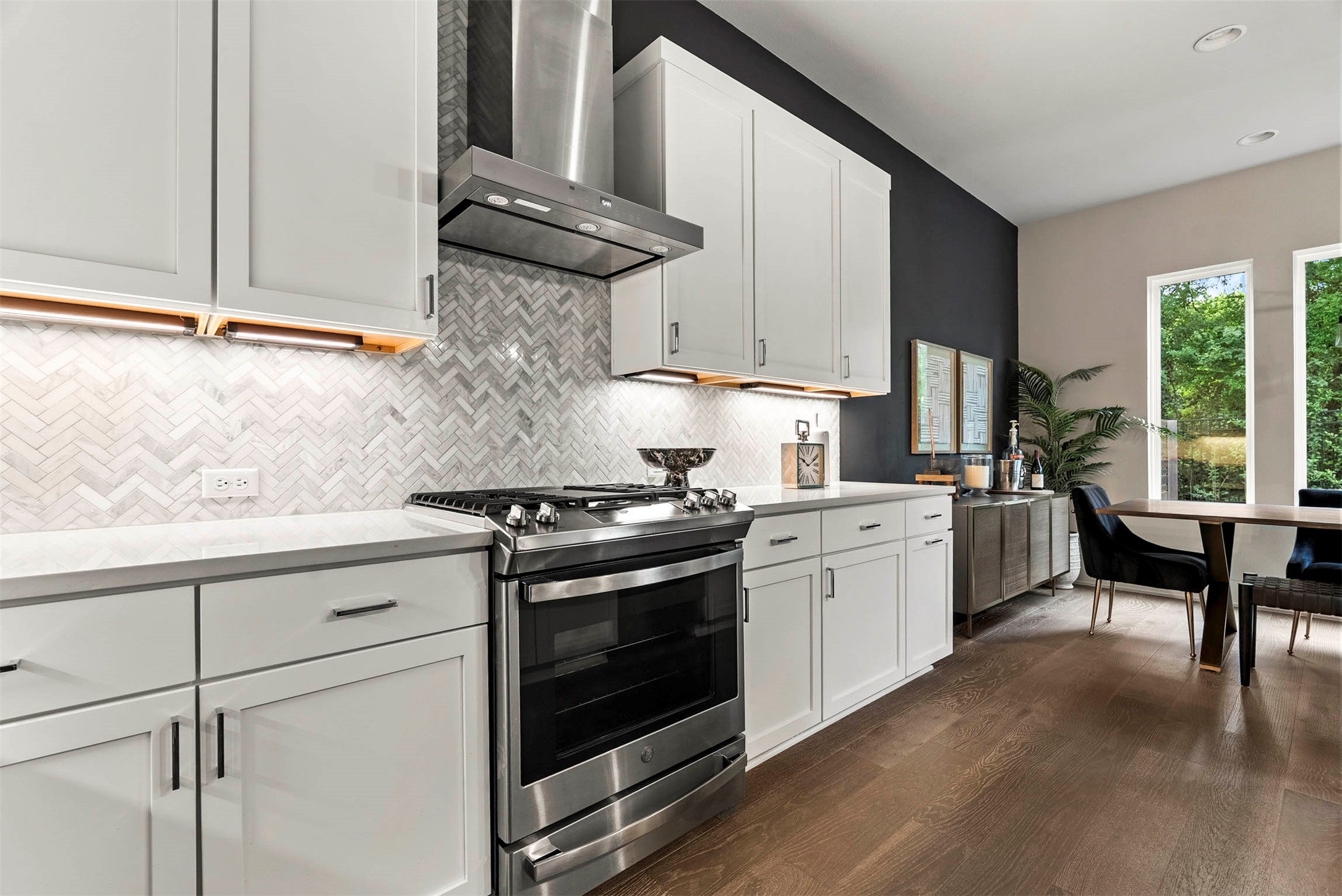 5200 Pink Poppy Pass Austin, TX 78735 - Photo 16 of 38 High-end stainless appliances and white cabinetry offer a crisp, modern aesthetic for any home chef