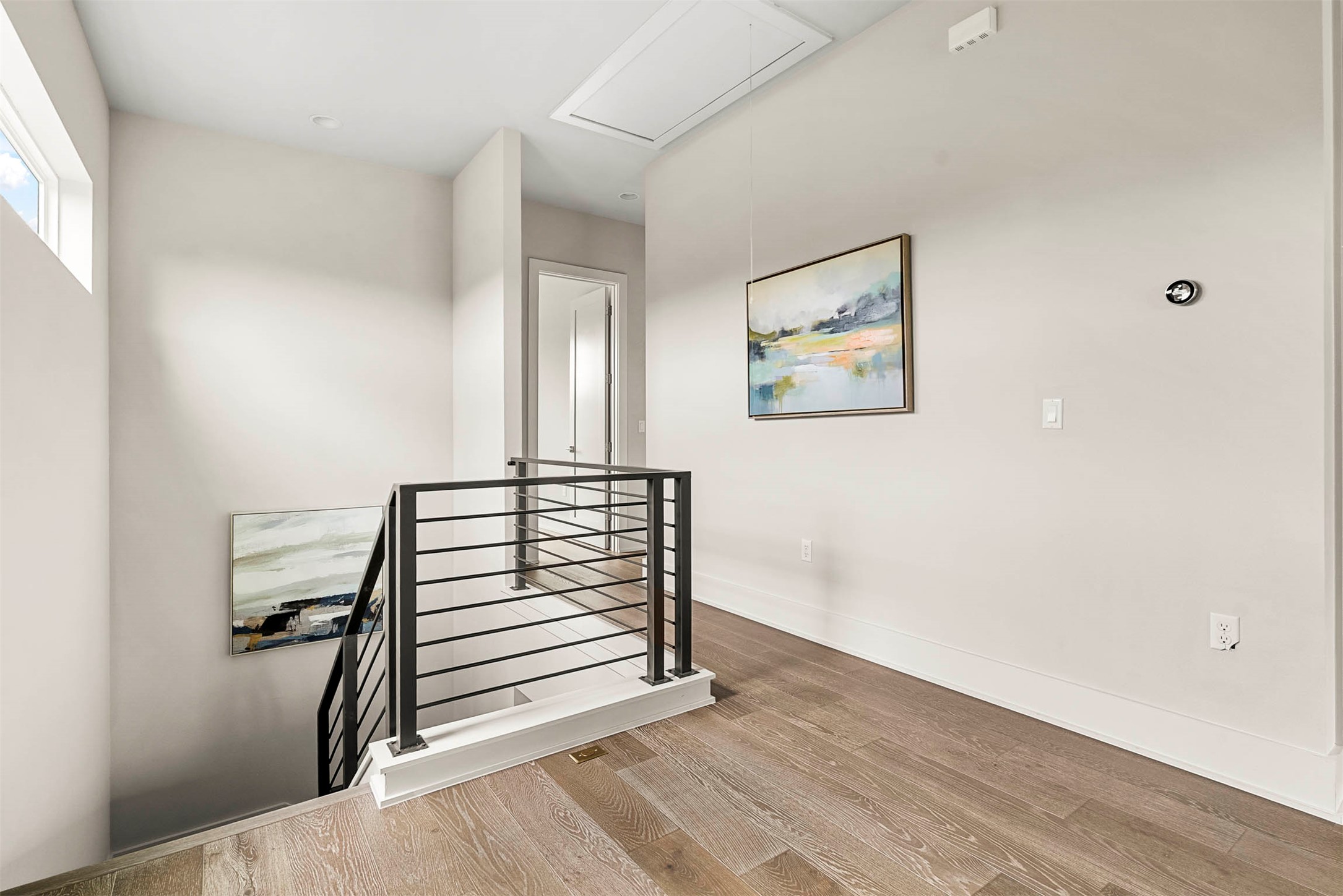 5200 Pink Poppy Pass Austin, TX 78735 - Photo 21 of 38 The second-floor landing serves as a central hub, creating a natural separation between the primary suite and the additional bedrooms for added privacy