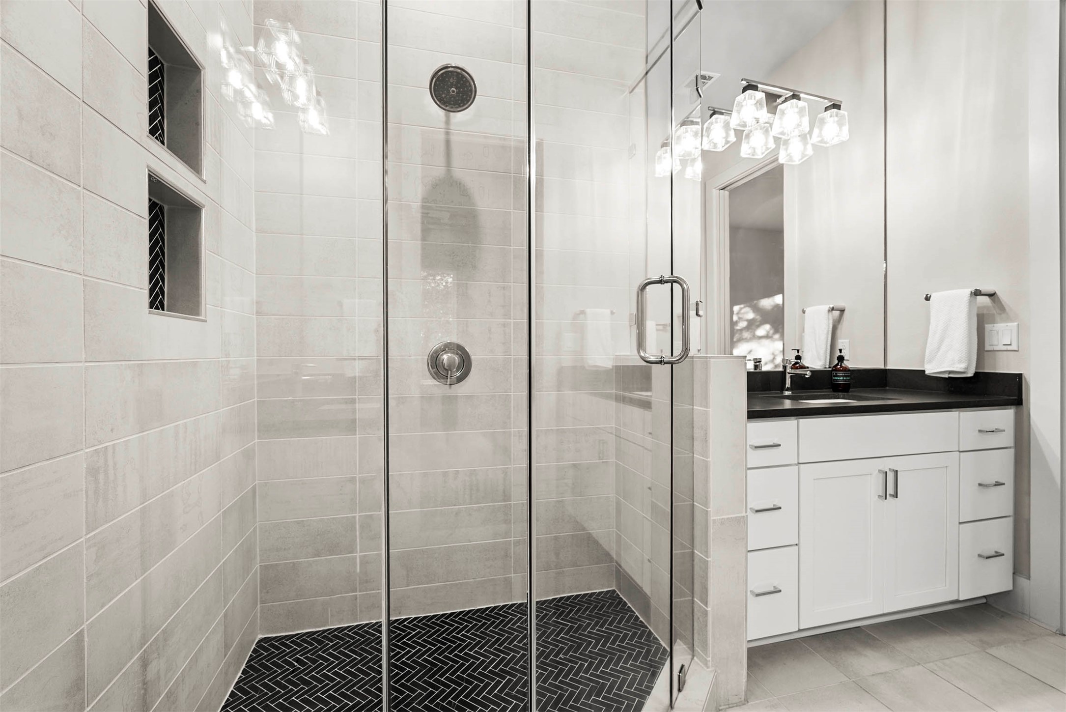 5200 Pink Poppy Pass Austin, TX 78735 - Photo 24 of 38 The ensuite bathroom features separate vanities and modern fixtures that maintain the home's sharp, lux aesthetic