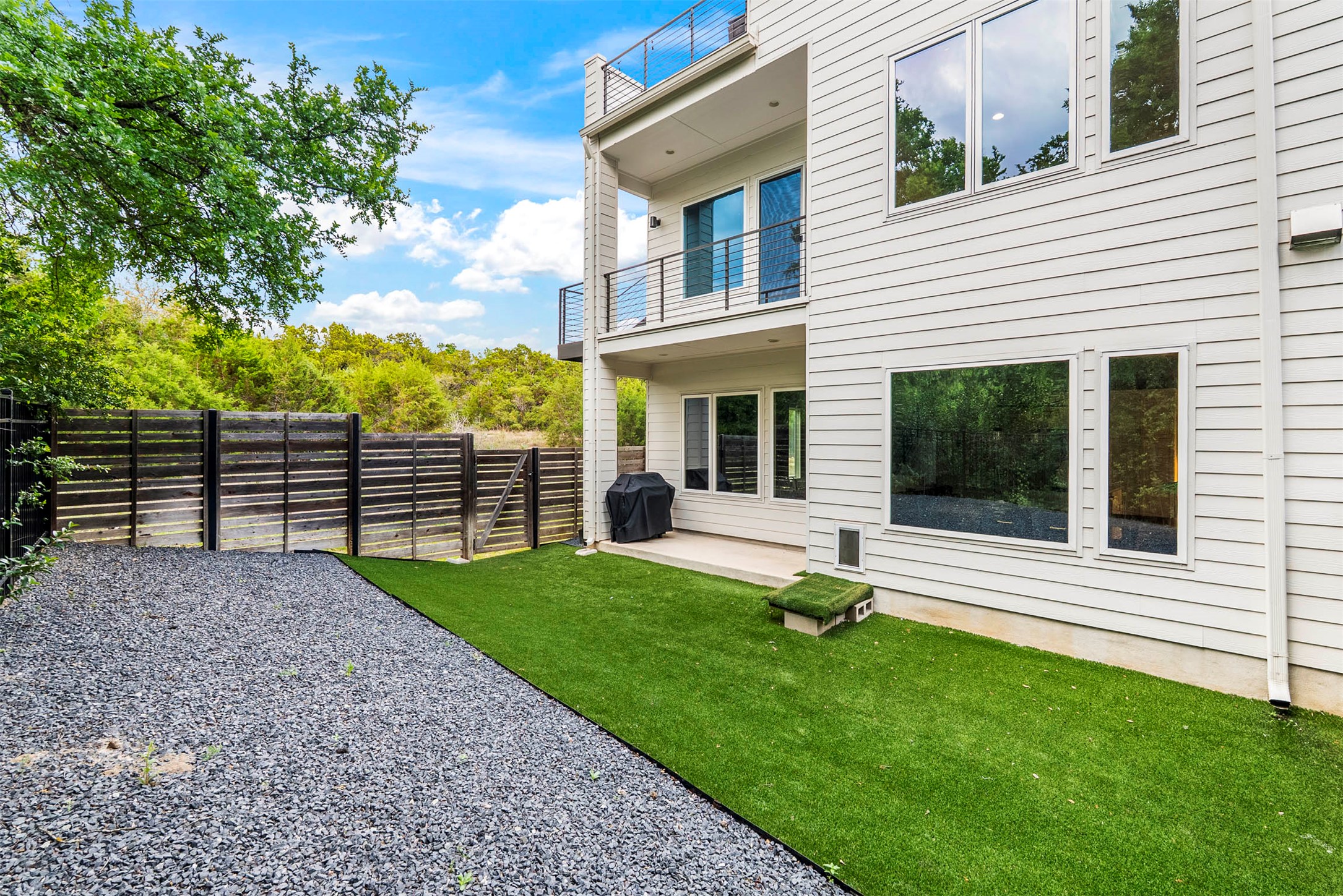 5200 Pink Poppy Pass Austin, TX 78735 - Photo 33 of 38 The backyard features high-quality turf and xeriscaping, making this a true lock-and-leave property with almost zero maintenance