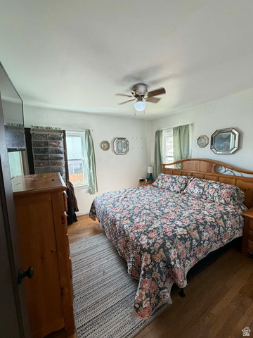 156 D Street Helper, UT 84526 - Photo 14 of 24 Bedroom with wood finished floors and ceiling fan