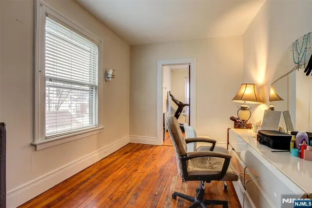 a bedroom with furniture and a window