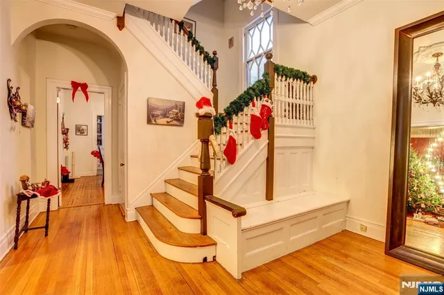 a view of entryway with wooden floor
