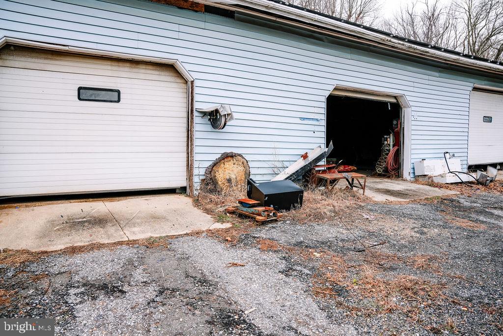76 Northville Road Bridgeton, NJ 08302 - Photo 19 of 63 a view of a backyard with a table and chairs and ice snow