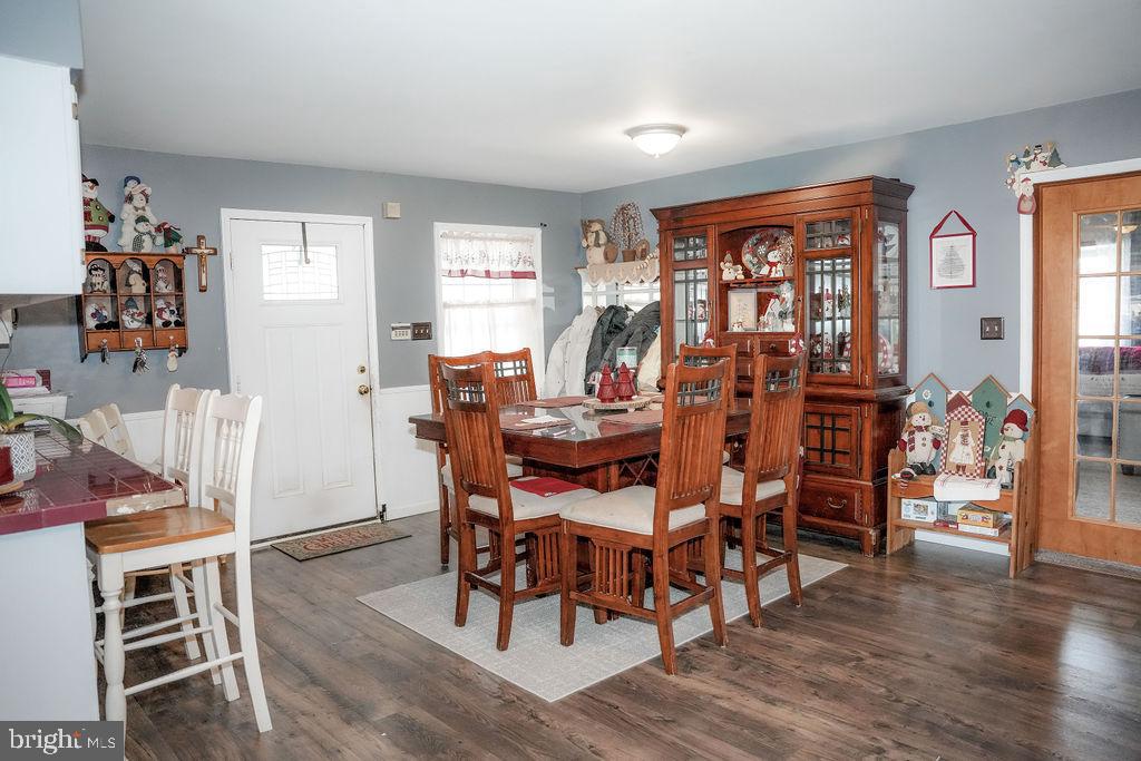 76 Northville Road Bridgeton, NJ 08302 - Photo 32 of 63 a view of a dining room with furniture and wooden floor