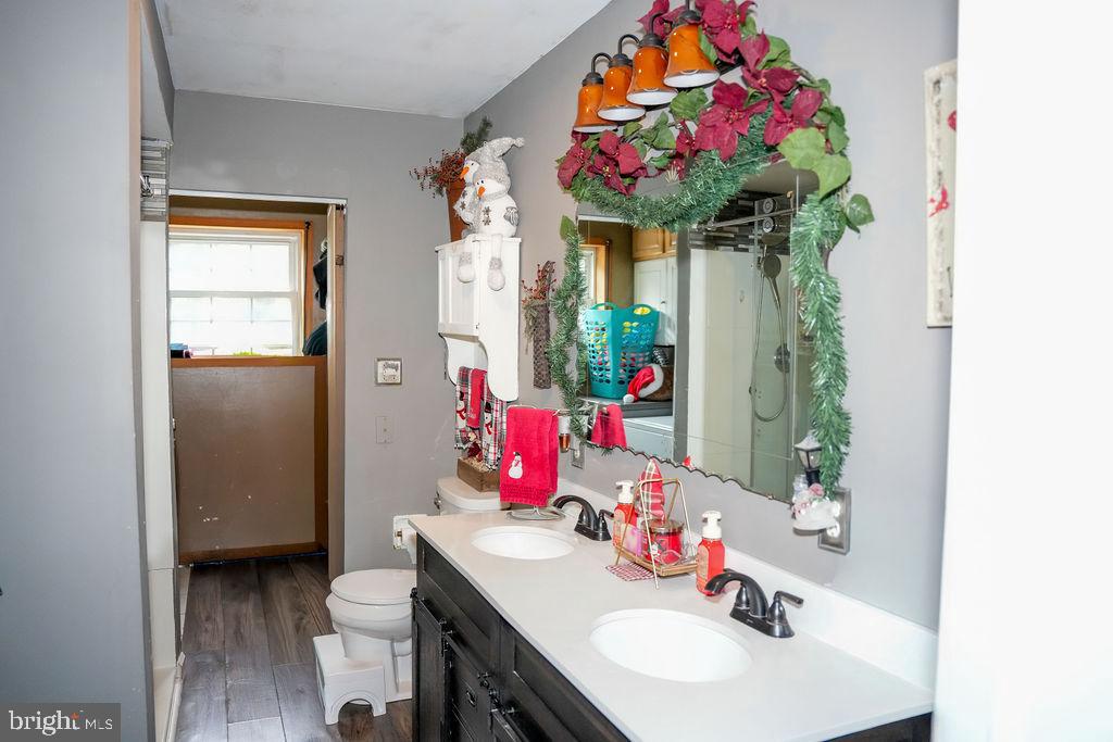 76 Northville Road Bridgeton, NJ 08302 - Photo 40 of 63 a bathroom with a sink vanity and a mirror
