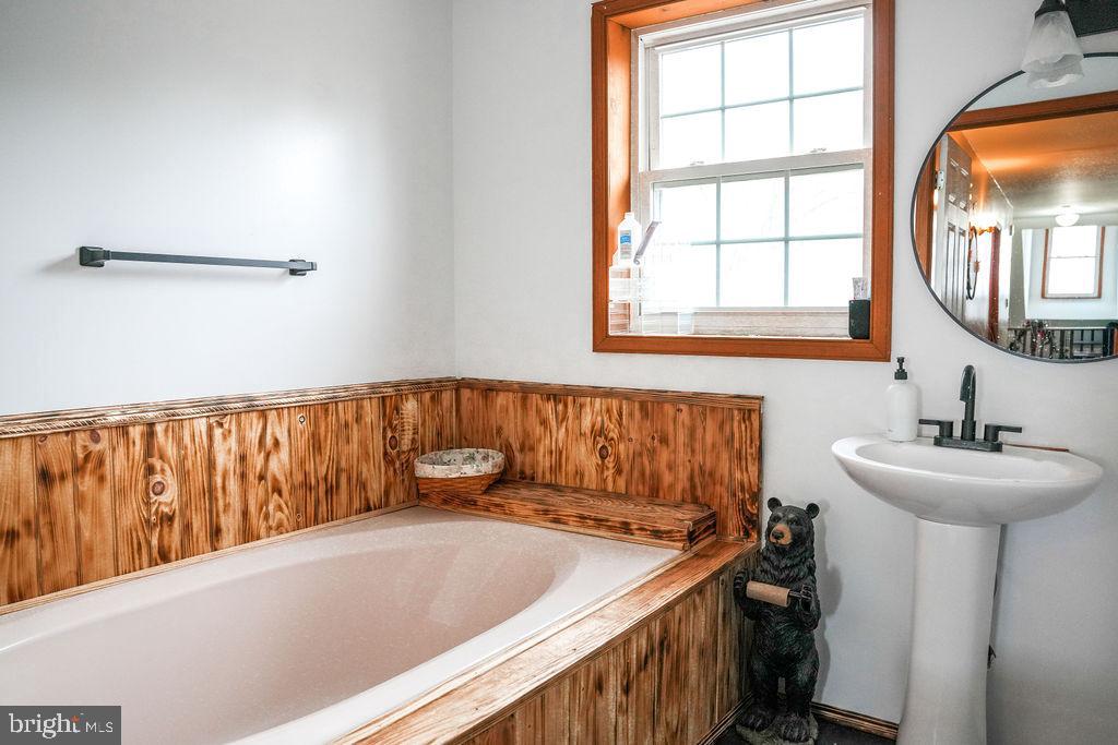 76 Northville Road Bridgeton, NJ 08302 - Photo 47 of 63 a bathroom with a sink and a mirror